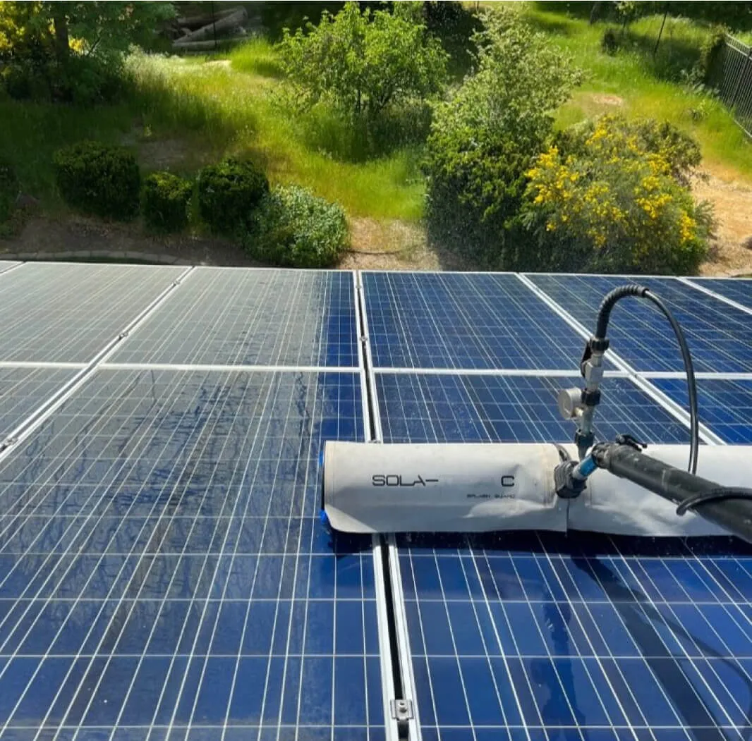 Residential rooftop solar panels being cleaned
