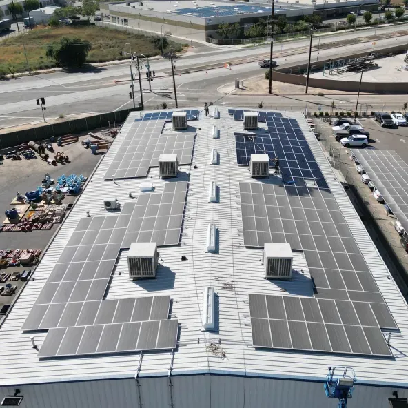 Golden Rays technician cleaning rooftop solar panels