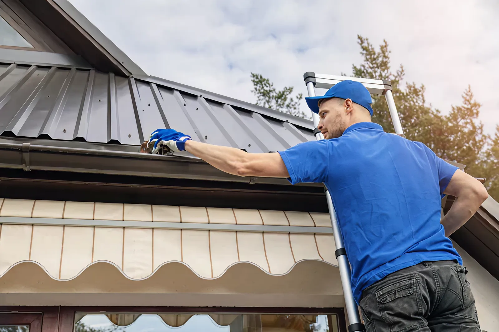 Soft wash roof cleaning on a solar-equipped home