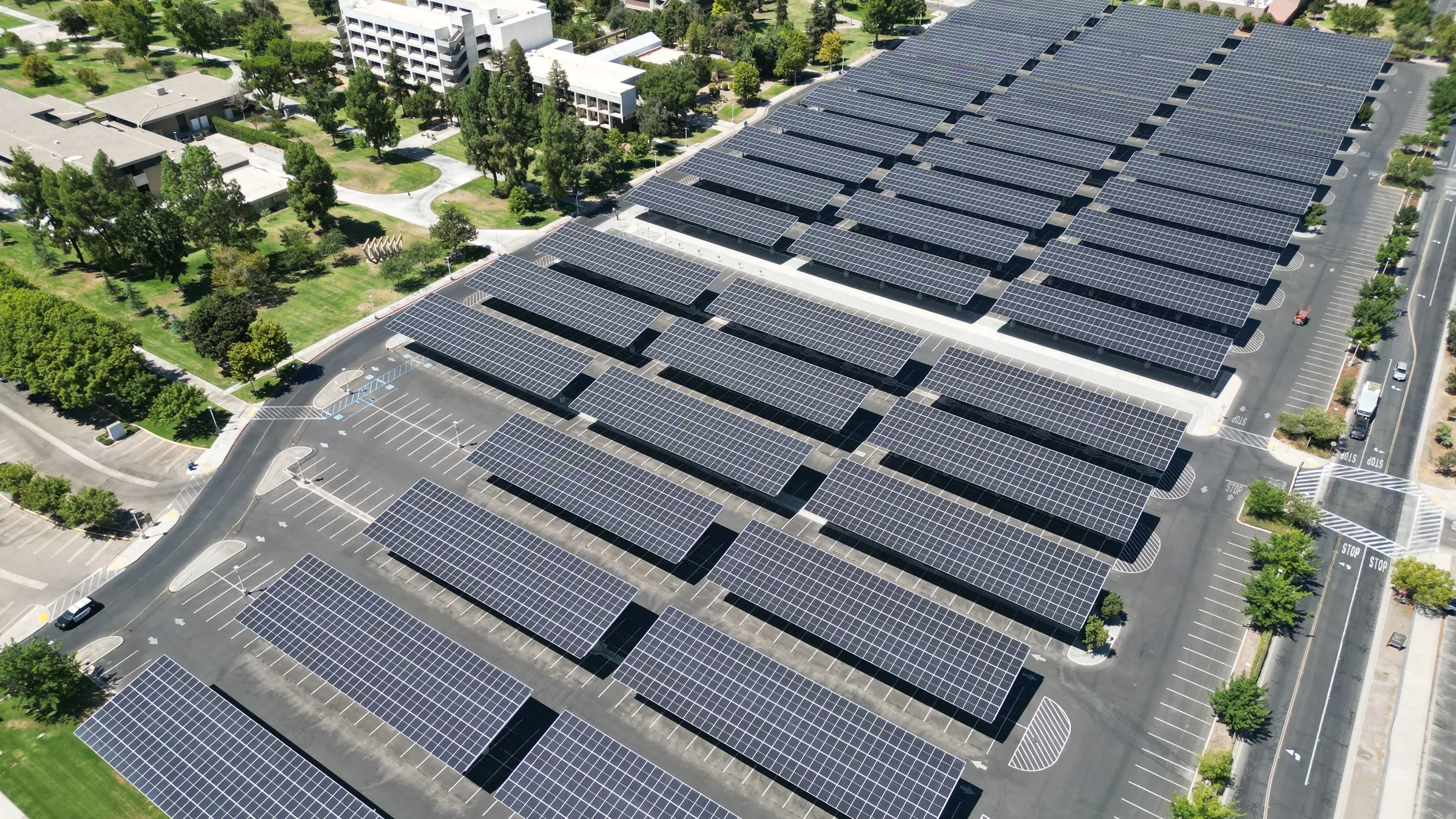 Solar panel cleaning at Fresno State University in Fresno, CA. Aerial view of the campus carport arrays serviced annually by Golden Rays